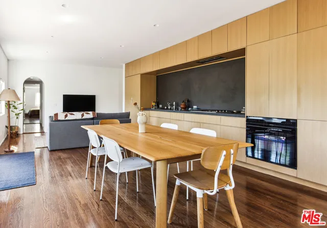 a view of a dining room with furniture and wooden floor