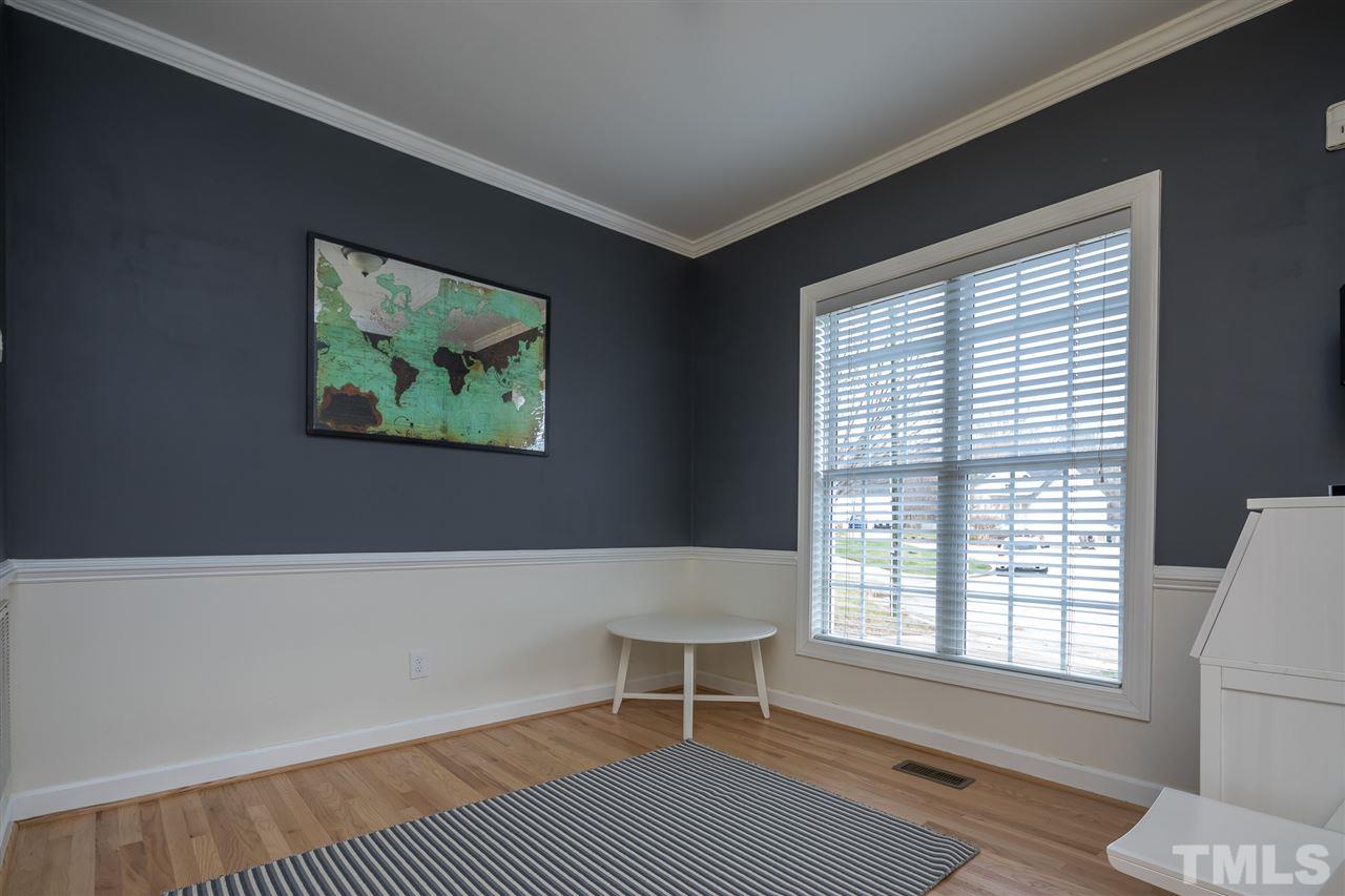 801 Shady Maple Court Raleigh, NC 27607 - Photo 3 of 22 a living room with a couch and a large window