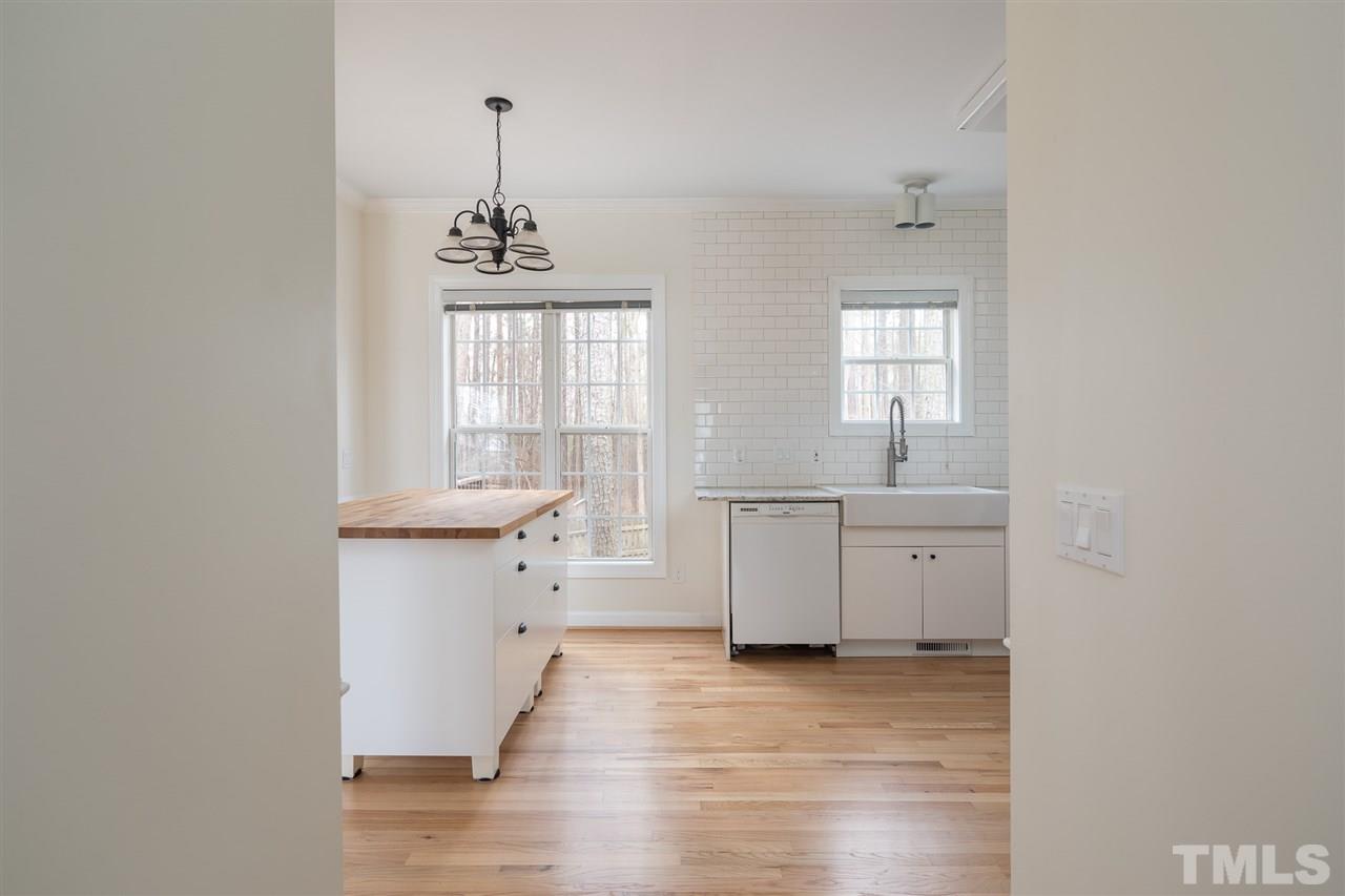 801 Shady Maple Court Raleigh, NC 27607 - Photo 4 of 22 a view of a kitchen with a sink cabinets and wooden floor