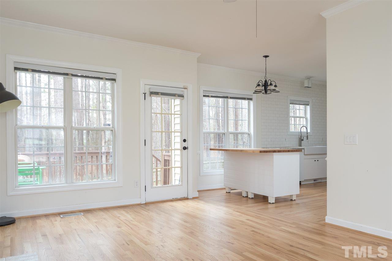 801 Shady Maple Court Raleigh, NC 27607 - Photo 8 of 22 a view of wooden floor and windows in a room