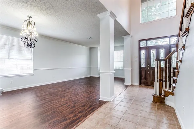 a view of a hallway view with wooden floor and staircase
