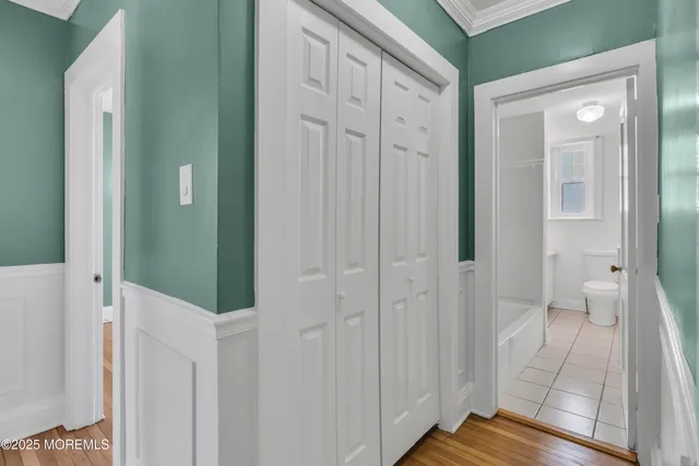 a view of a bathroom from a hallway