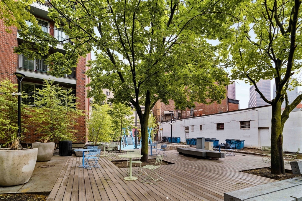5 North Margin Street, Unit 2 Boston, MA 02113 - Photo 11 of 12 a view of a patio with couches and table and chairs and wooden floor