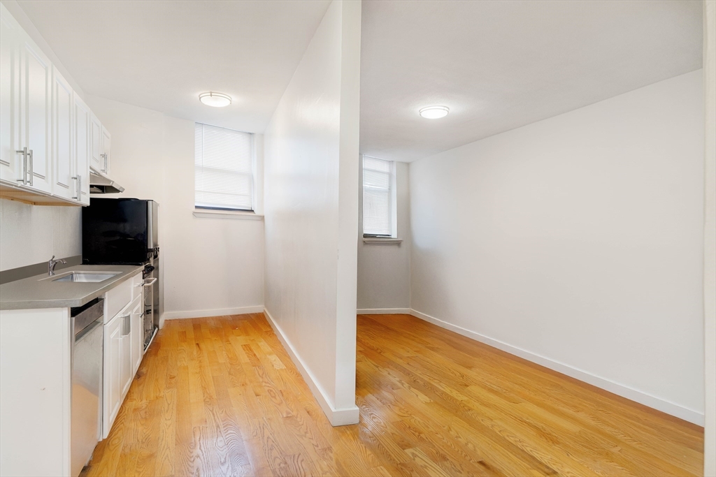 5 North Margin Street, Unit 2 Boston, MA 02113 - Photo 2 of 12 a view of a kitchen with a sink and a refrigerator