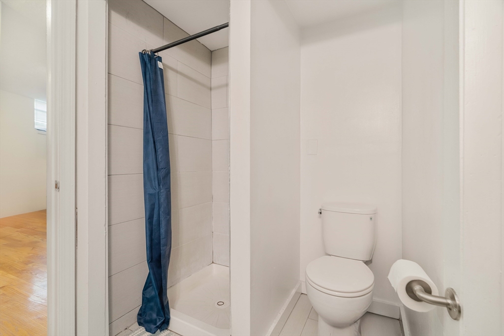 5 North Margin Street, Unit 2 Boston, MA 02113 - Photo 5 of 12 a white toilet sitting next to a shower
