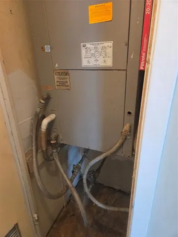 a bathroom with a sink mirror vanity and toilet