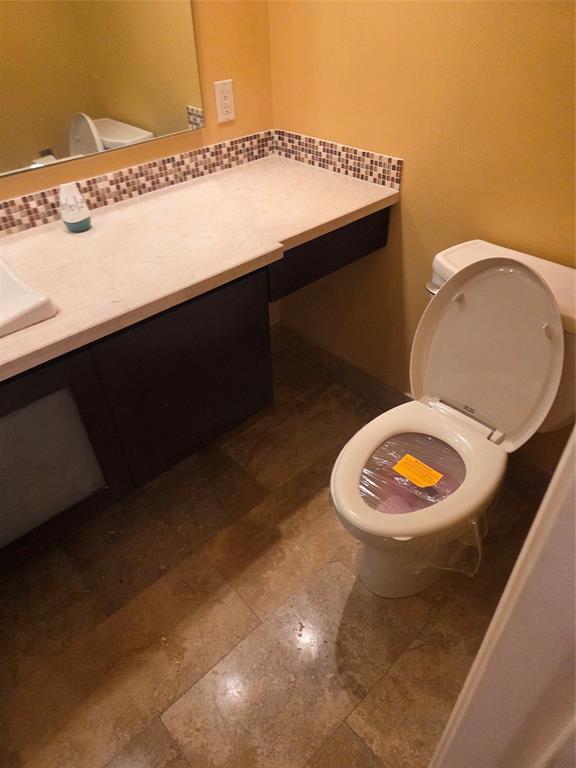2750 Northeast 183rd Street, Unit 1803 Aventura, FL 33160 - Photo 8 of 14 a bathroom with a sink mirror vanity and toilet