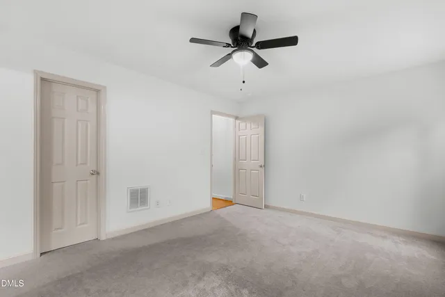 a view of room with ceiling fan