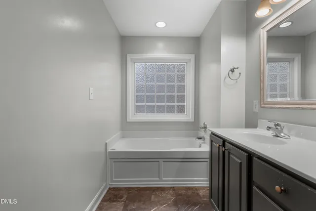 a bathroom with a sink and a bathtub