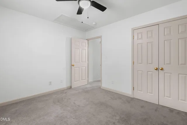 an empty room with fan