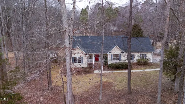 a view of a house next to a yard
