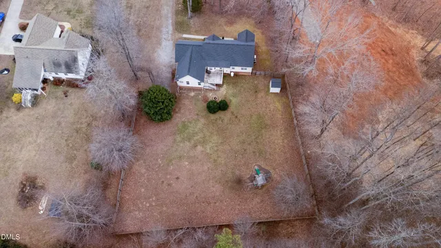 an aerial view of residential house with outdoor space