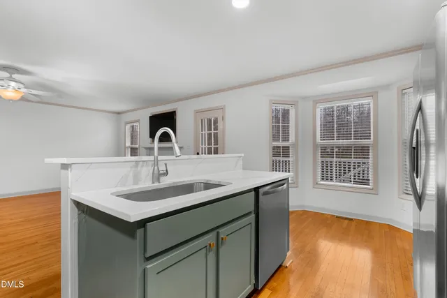a kitchen with a sink and a window