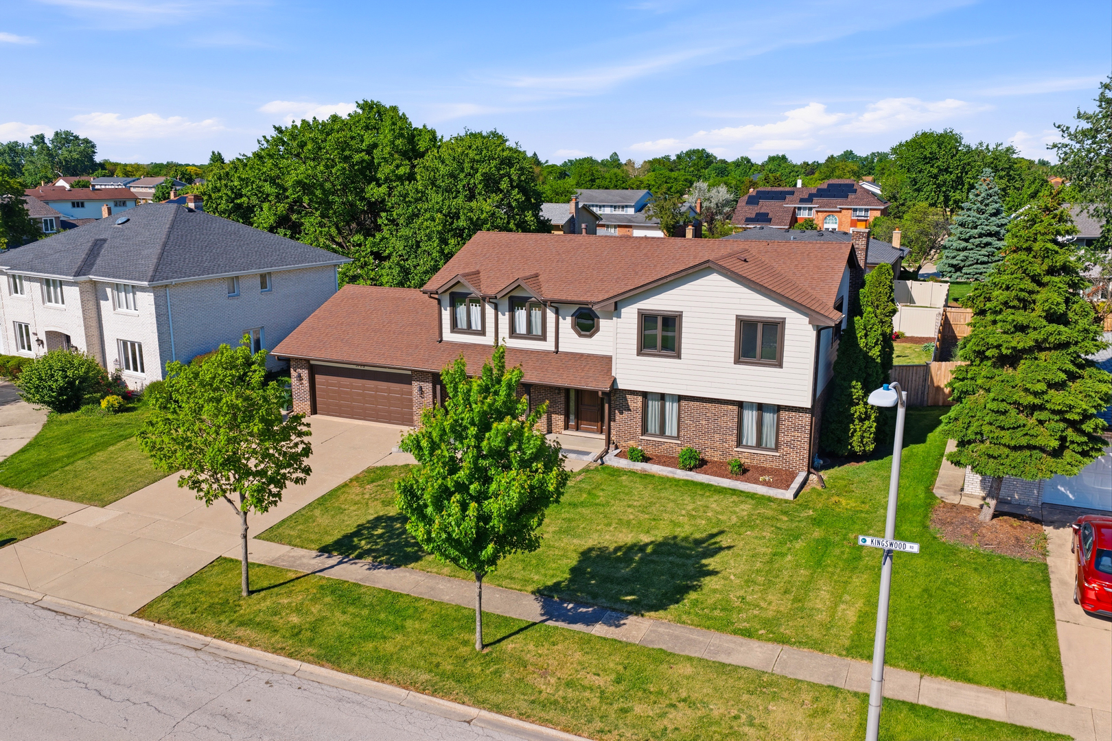 6723 Kingswood Road Willowbrook, IL 60527 - Photo 5 of 51 a aerial view of a house with a yard and potted plants
