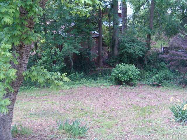 210 Myers Avenue Raleigh, NC 27604 - Photo 3 of 12 Really nice landscaping gives backyard a cool feeling