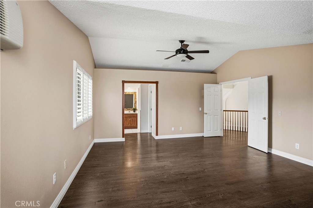 6568 Balzac Circle Riverside, CA 92506 - Photo 34 of 62 Upstairs primary bedroom with en-suite bathroom. Mini split ac for instant cold air as well as the central ac. Ceiling fan above.