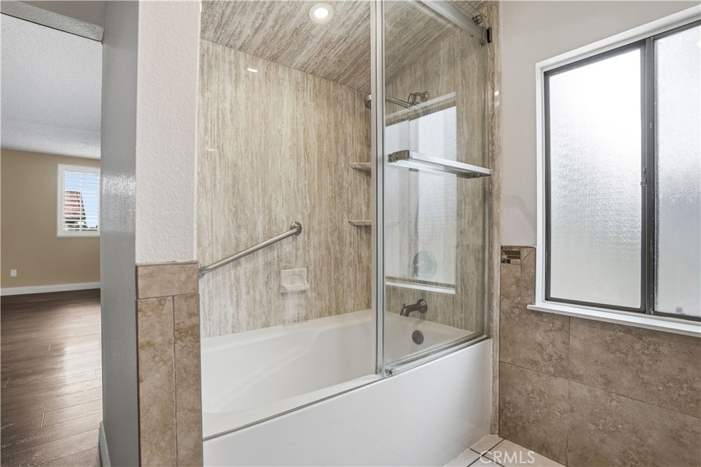 6568 Balzac Circle Riverside, CA 92506 - Photo 38 of 62 Primary upstairs bathroom is tub/shower glass encased.