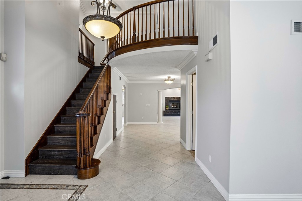6568 Balzac Circle Riverside, CA 92506 - Photo 6 of 62 Sweeping staircase to the 3 more upstairs bedrooms. Custom lighting throughout.