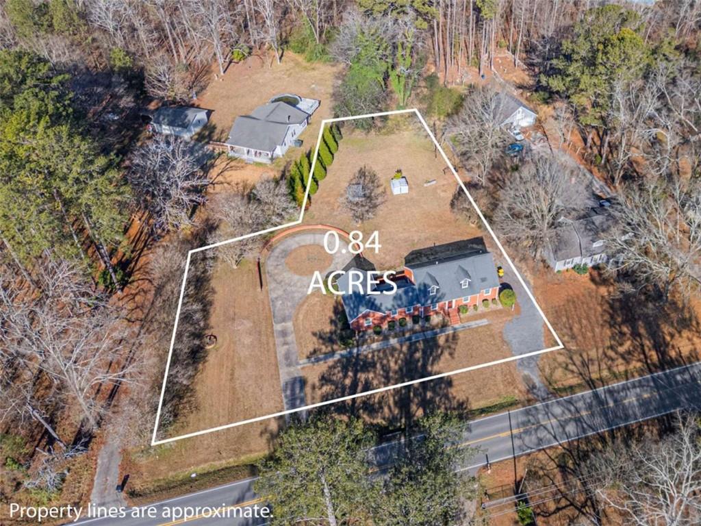 614 Burnett Ferry Road Southwest Rome, GA 30165 - Photo 29 of 29 a view of swimming pool with a yard and sitting space
