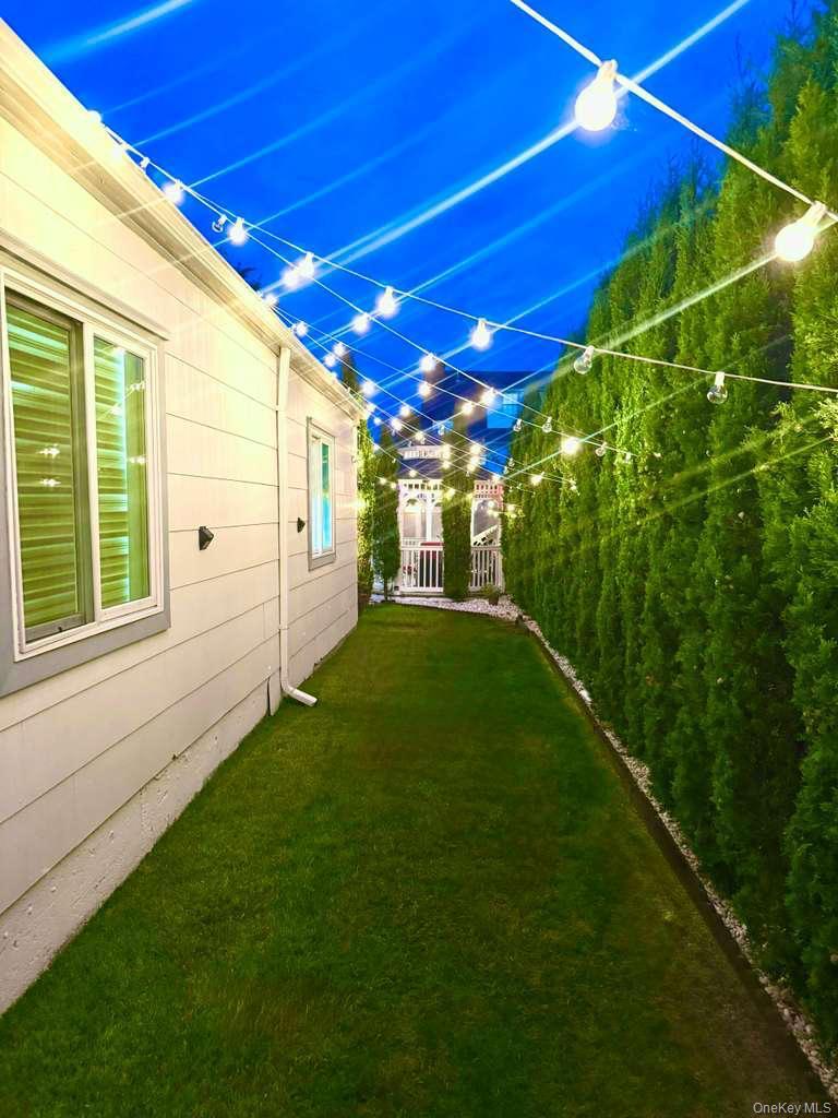 62 Walnut Road Inwood, NY 11096 - Photo 23 of 27 a view of a backyard with garden