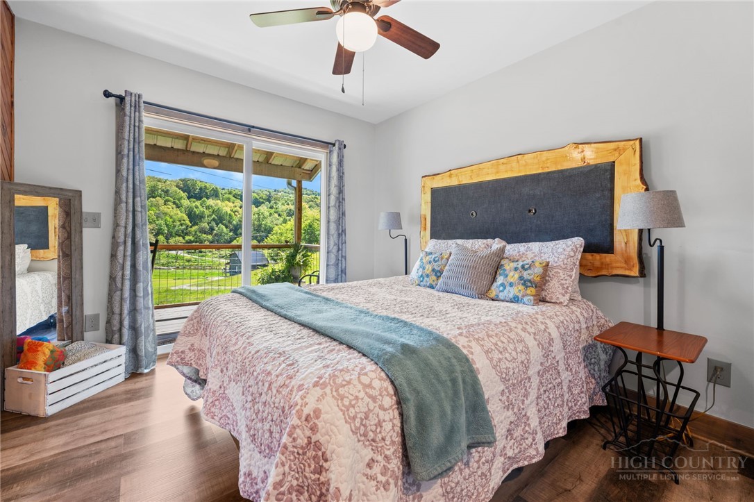 634-636 Watauga River Road Sugar Grove, NC 28679 - Photo 17 of 50 a bedroom with a bed and a large window