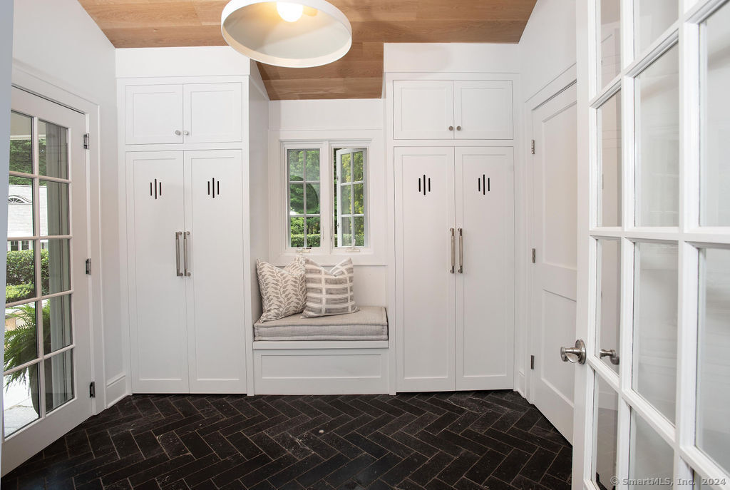474 Brookside Road Norwalk, CT 06850 - Photo 16 of 40 a view of a bathroom with a sink and a mirror