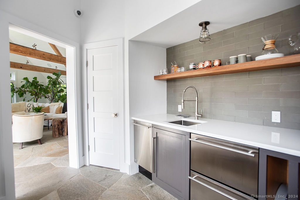 474 Brookside Road Norwalk, CT 06850 - Photo 29 of 40 a kitchen with a sink and wooden floor