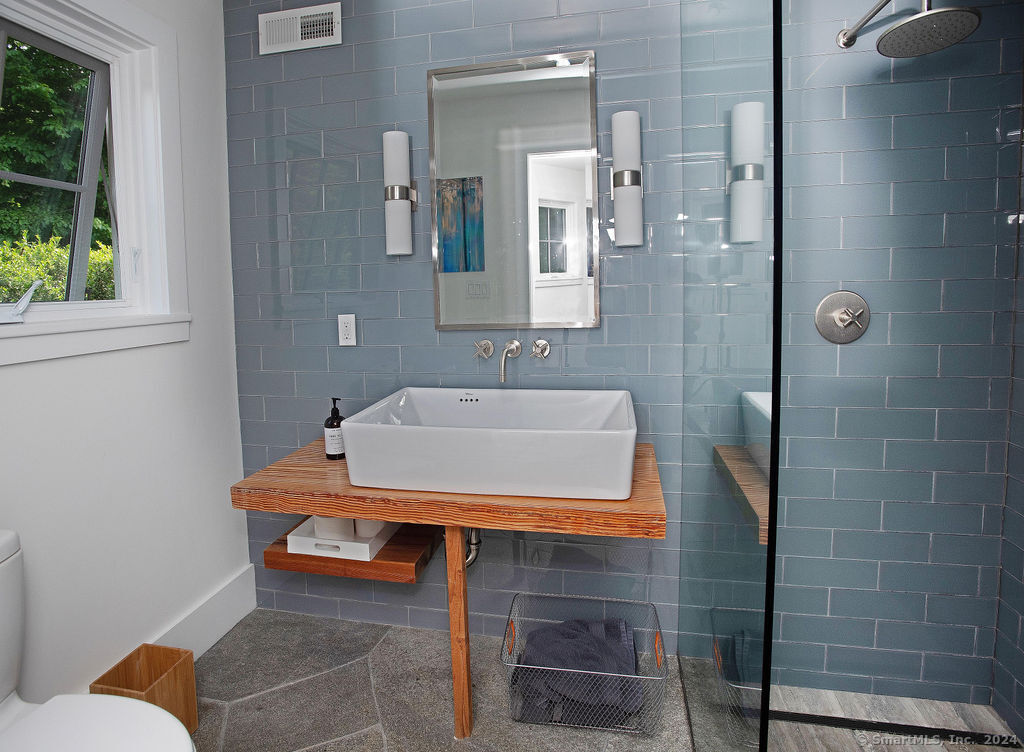 474 Brookside Road Norwalk, CT 06850 - Photo 33 of 40 a bathroom with a sink toilet and shower