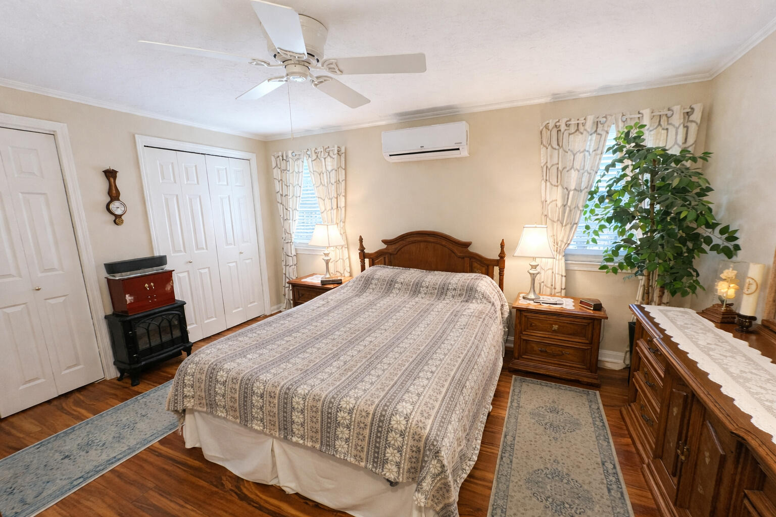441 Buck Island Road, Unit B1 West Yarmouth, MA 02673 - Photo 18 of 31 a bedroom with a bed and a chandelier