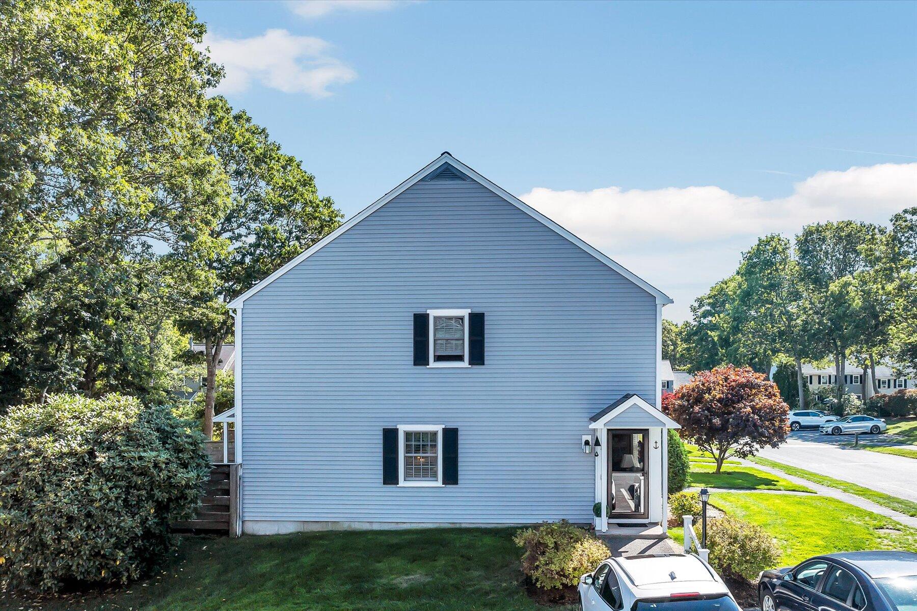 441 Buck Island Road, Unit B1 West Yarmouth, MA 02673 - Photo 2 of 31 a view of backyard of house and car parked