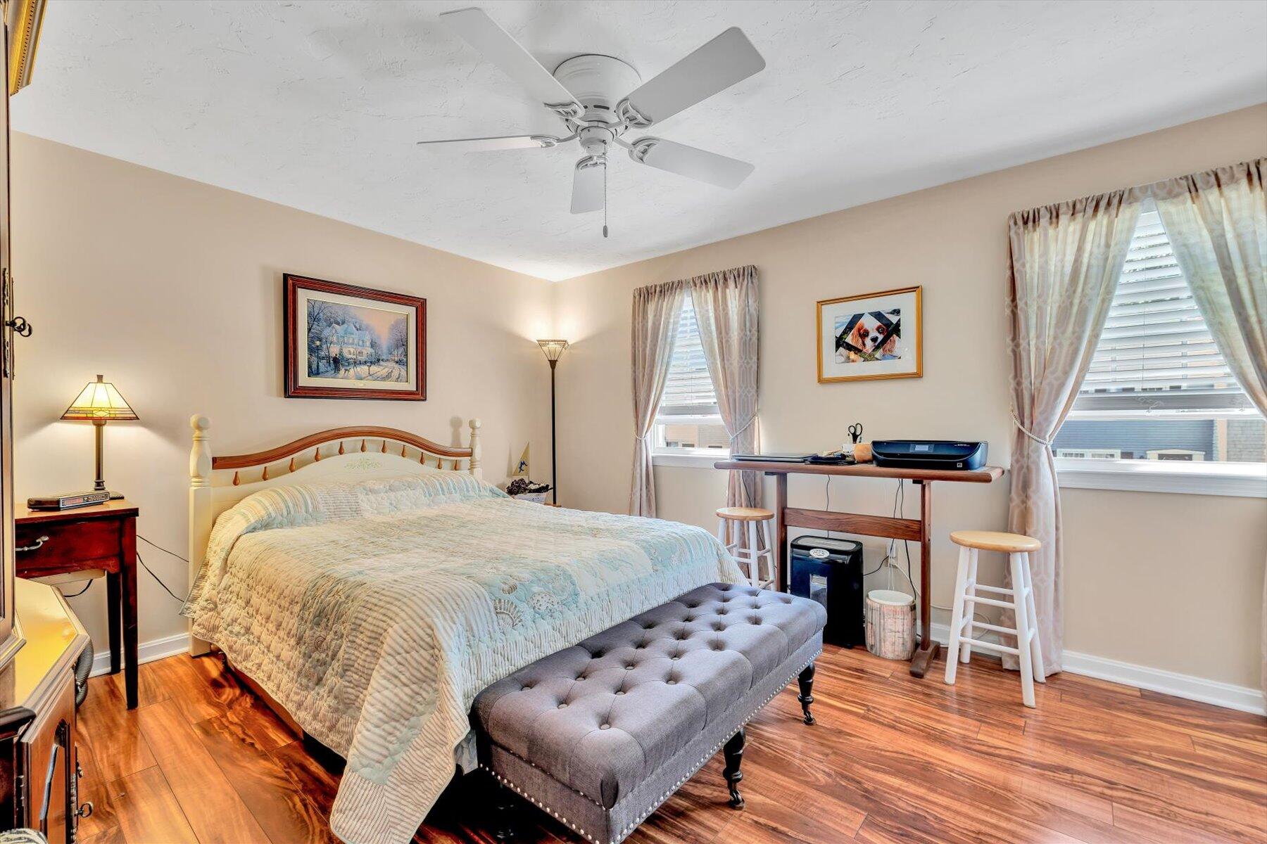 441 Buck Island Road, Unit B1 West Yarmouth, MA 02673 - Photo 22 of 31 a bedroom with a bed and a table with wooden floor