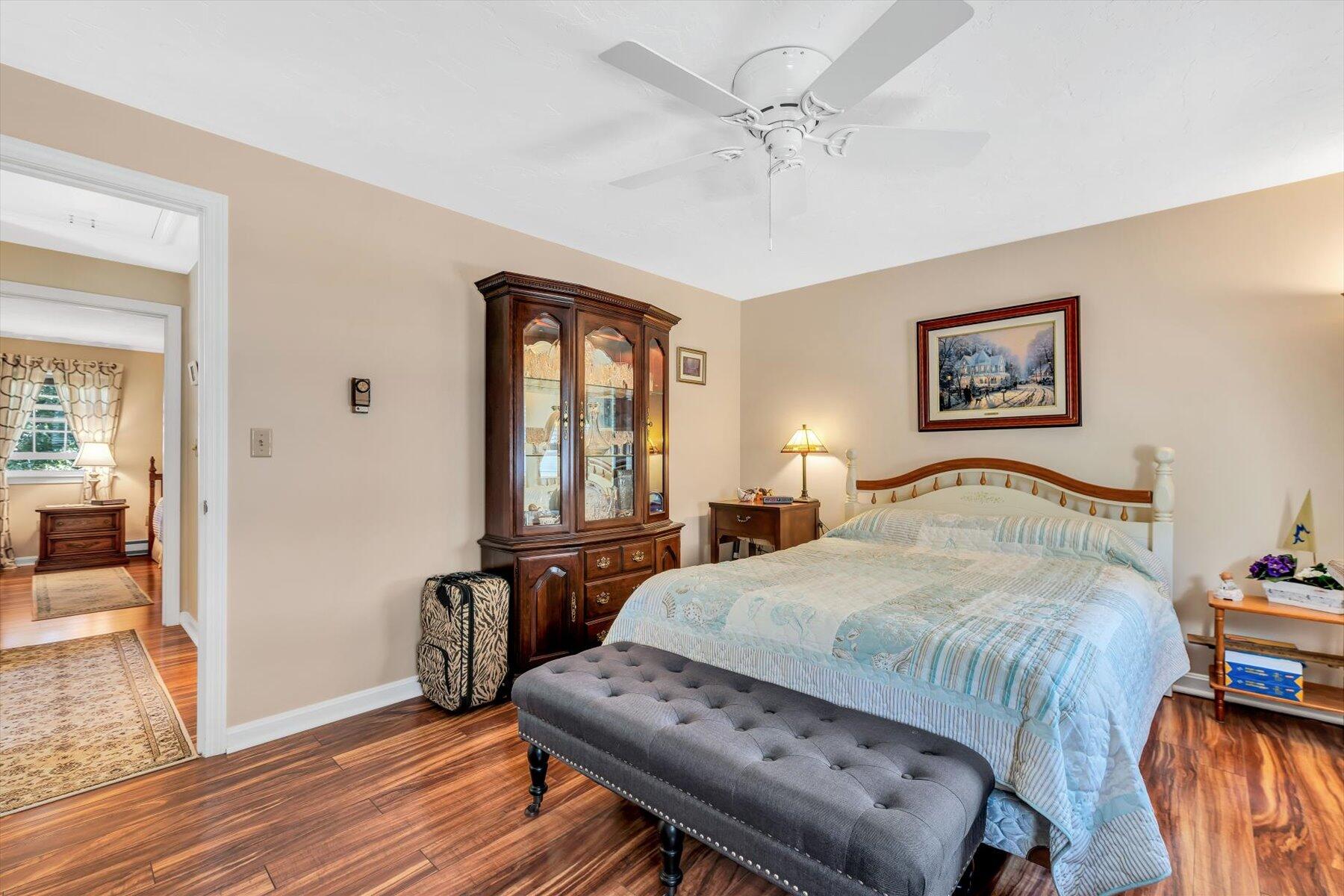 441 Buck Island Road, Unit B1 West Yarmouth, MA 02673 - Photo 23 of 31 a bedroom with a bed and wooden floor