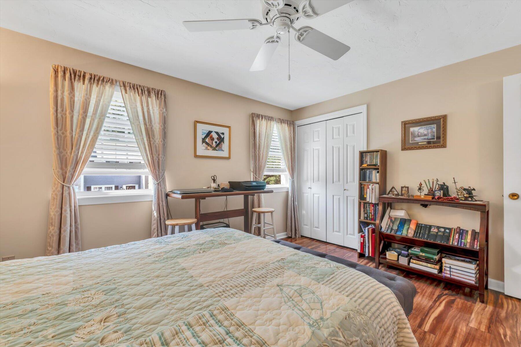 441 Buck Island Road, Unit B1 West Yarmouth, MA 02673 - Photo 25 of 31 a bedroom with a bed and a chandelier