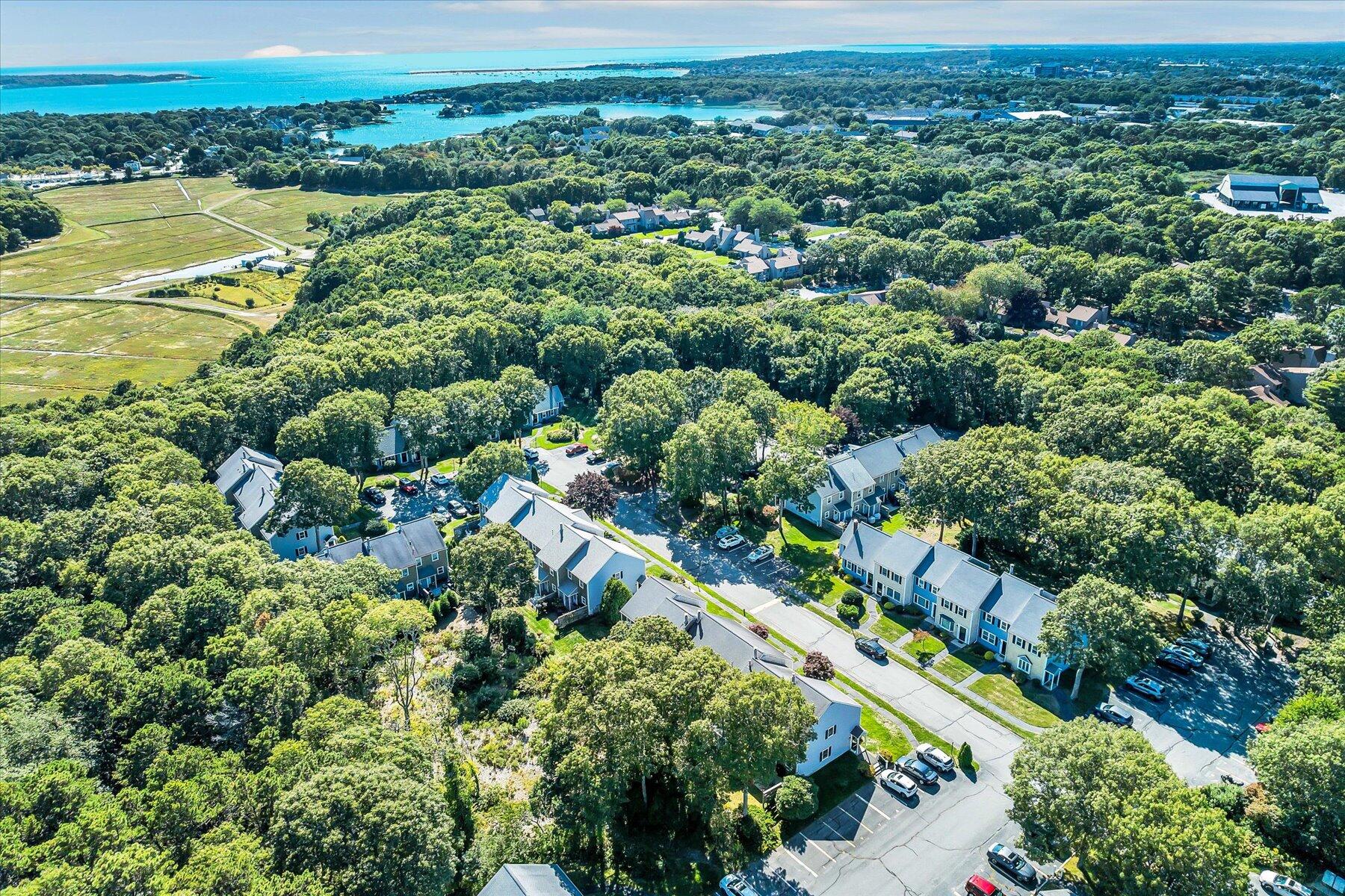 441 Buck Island Road, Unit B1 West Yarmouth, MA 02673 - Photo 27 of 31 an aerial view of residential houses with outdoor space and trees