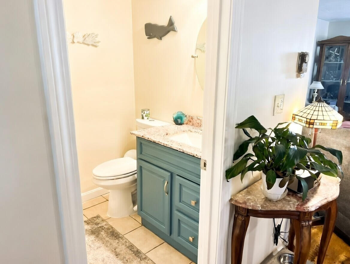 441 Buck Island Road, Unit B1 West Yarmouth, MA 02673 - Photo 10 of 31 a bathroom with a sink and toilet