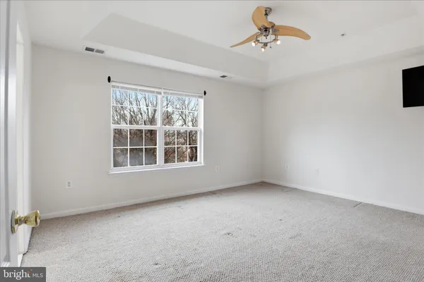 a view of empty room with windows