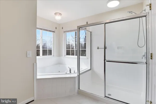 a bathroom with a sink vanity and mirror