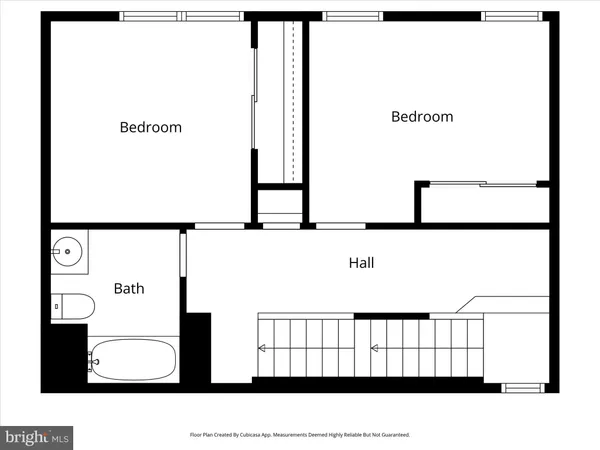 a view of a street with a building in the background