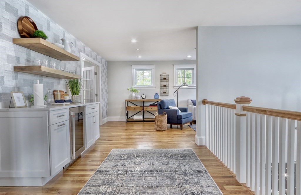 67 Rowell Road, Unit 67 Middleton , MA 01923 - Photo 23 of 40 a living room with furniture and a rug