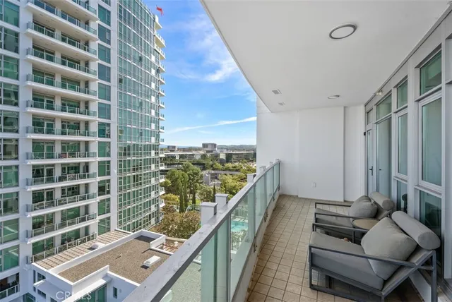 a view of balcony with furniture