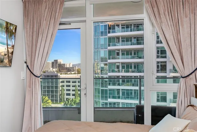 a view of a living room and balcony
