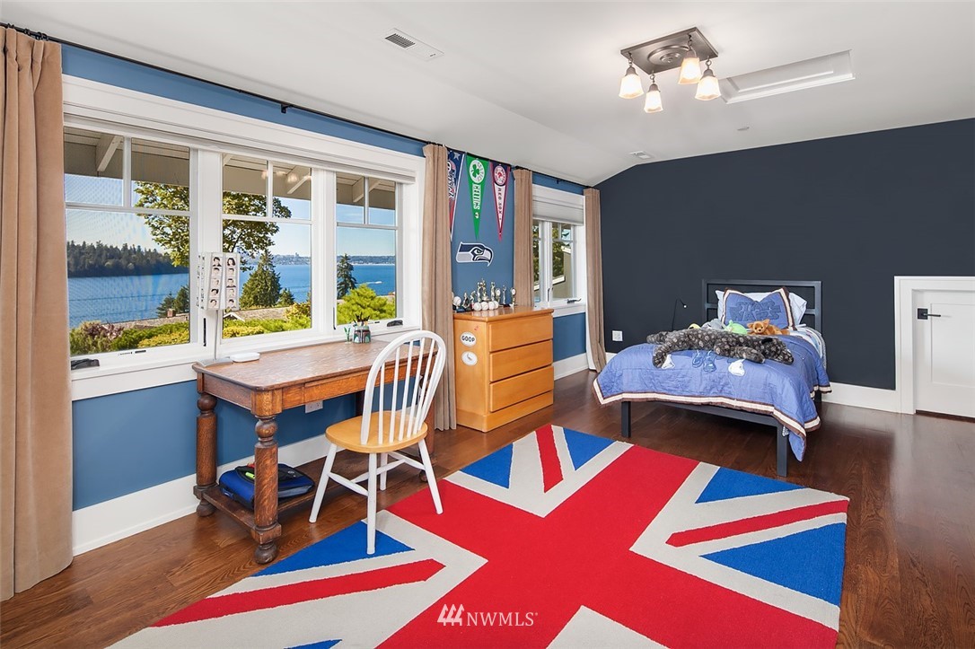 17 Brook Bay Road Mercer Island, WA 98040 - Photo 16 of 25 a bedroom with a bed and wooden floor