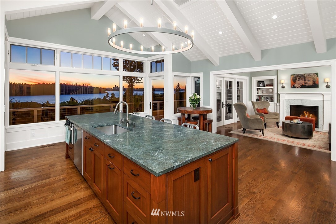 17 Brook Bay Road Mercer Island, WA 98040 - Photo 8 of 25 an outdoor kitchen with stainless steel appliances granite countertop a stove and large wooden cabinets