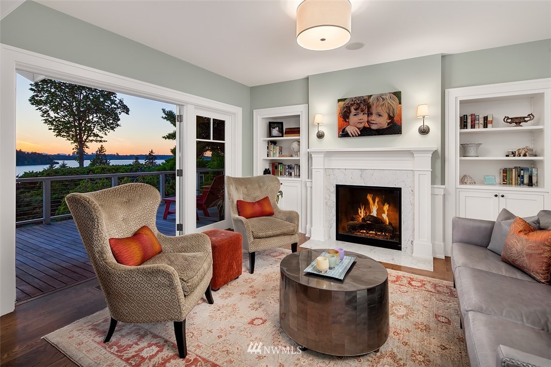 17 Brook Bay Road Mercer Island, WA 98040 - Photo 9 of 25 a living room with furniture a flat screen tv and a fireplace