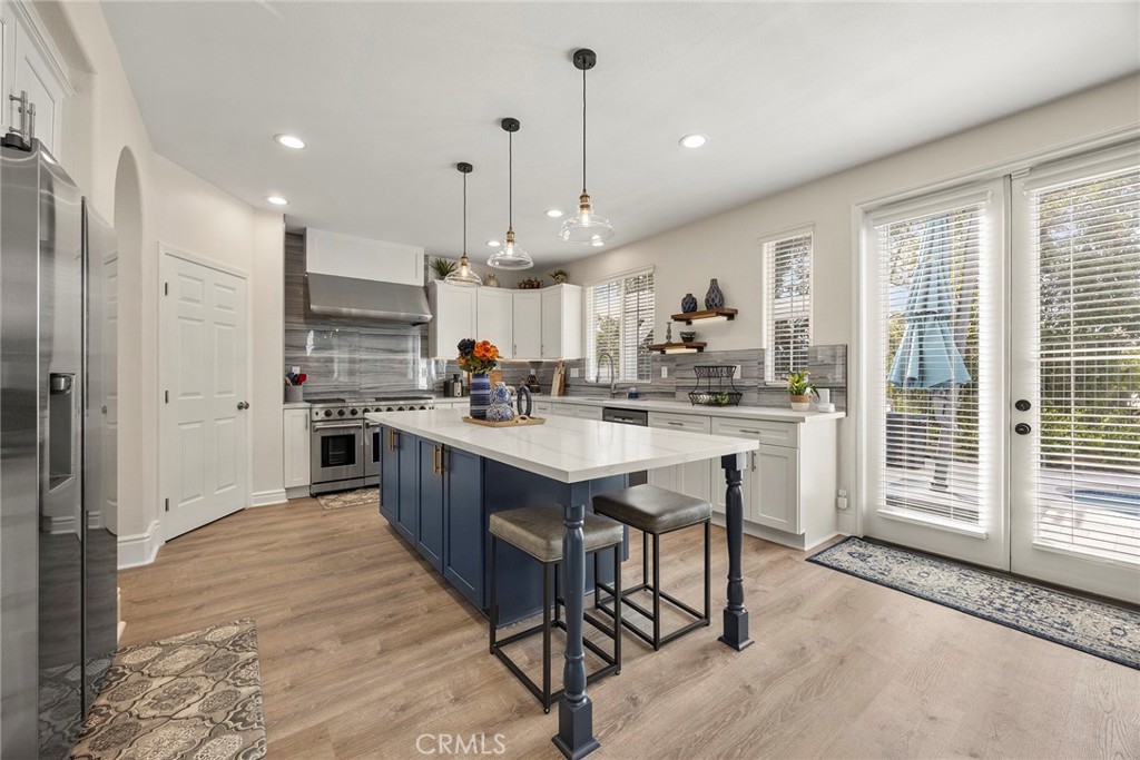 16 Kempton Lane Ladera Ranch, CA 92694 - Photo 22 of 60 Kitchen island. French doors to backyard.