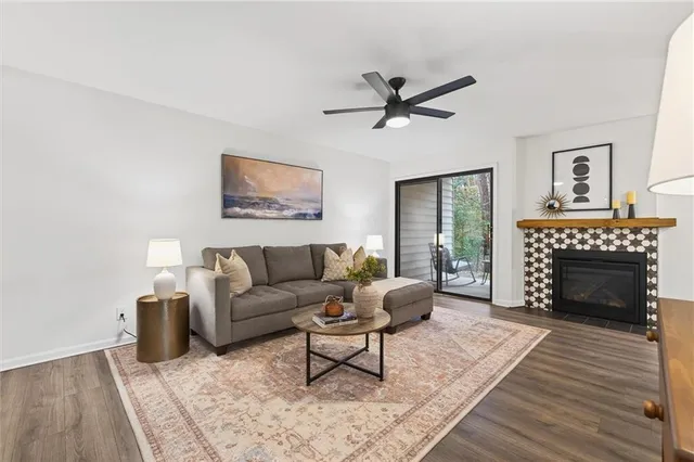 a living room with furniture and wooden floor