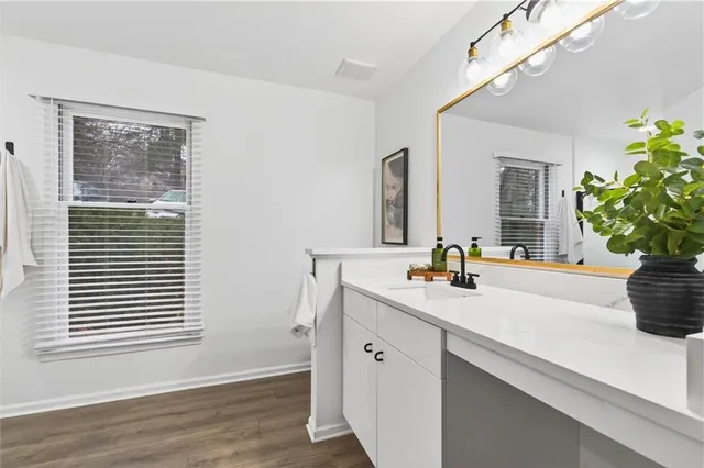 a bathroom with a glass shower door