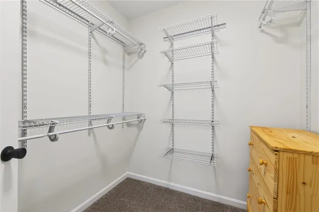 a bed room with a bed and a window