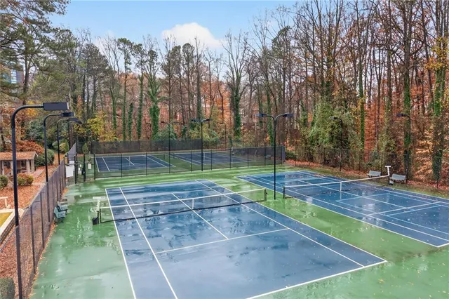 a view of a backyard with swimming pool