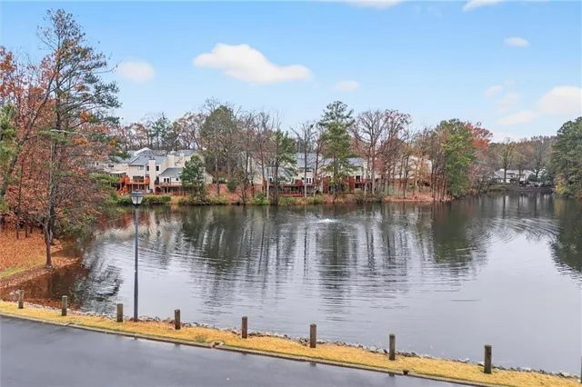 a front view of a house with a yard table and chairs